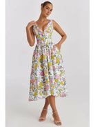 Yellow floral Angelica elegant summer dress by Lumina Vancouver, lightweight fabric, sleeveless design, perfect for warm weather.