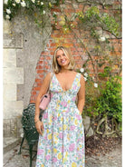 Yellow floral Angelica elegant summer dress by Lumina Vancouver, featuring a flowing design and lightweight fabric.