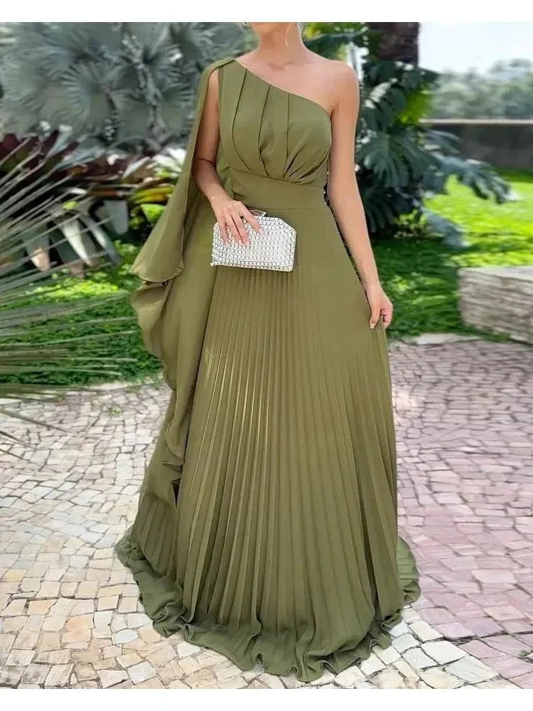 Green Araluen one-shoulder pleated dress by Lumina Vancouver, showcasing elegant draping and stylish design.