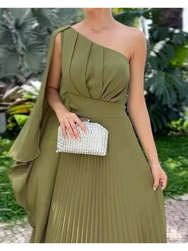 Green Araluen one-shoulder pleated dress by Lumina Vancouver, showcasing a stylish, elegant design with flowing fabric.
