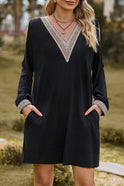 Black Lumina Wear Aria mini casual dress with V-neck and lace trim, featuring a stylish, fitted silhouette.