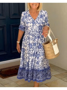 Blue ARIA™ floral dress with V-neck by Lumina Vancouver, elegant design, perfect for stylish occasions.