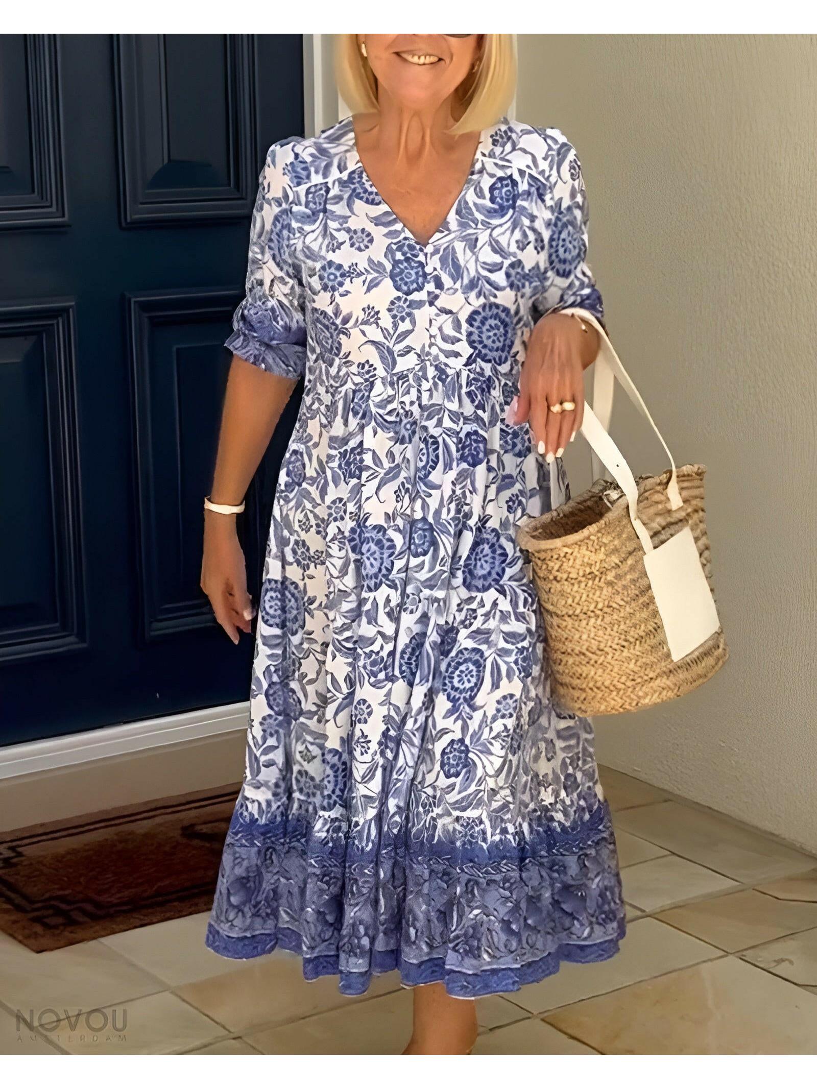 Blue ARIA™ floral dress with V-neck by Lumina Vancouver, elegant design, perfect for stylish occasions.