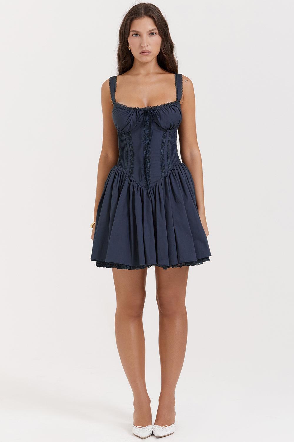 White mini dress from Lumina Vancouver with a lace-trim bodice, featuring a fitted silhouette and delicate lace details.