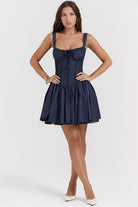 White mini dress with lace-trim bodice by Lumina Vancouver, featuring a fitted silhouette and delicate lace detailing.