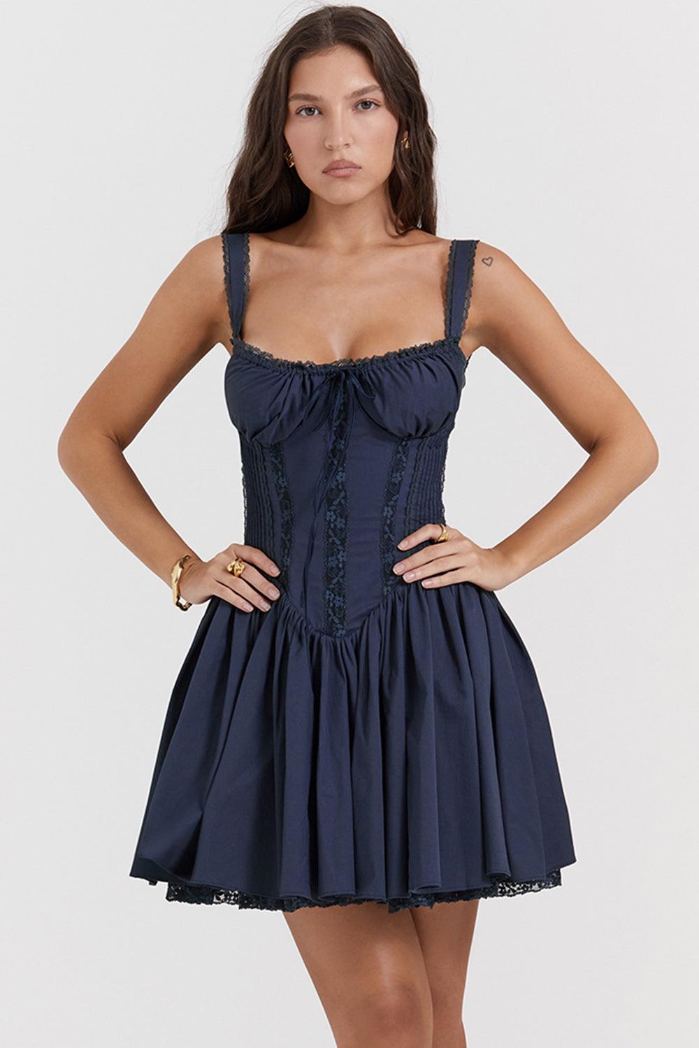 White mini dress by Lumina Vancouver featuring a lace-trimmed bodice and short sleeves, styled with a fitted silhouette.