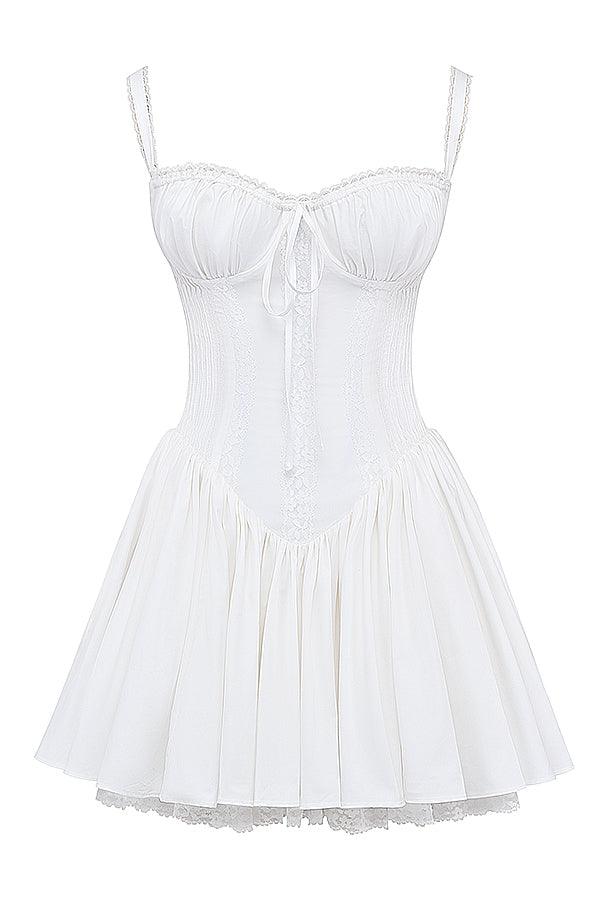 White mini dress by Lumina Vancouver with lace-trim bodice and short sleeves, featuring a fitted silhouette and delicate detailing.