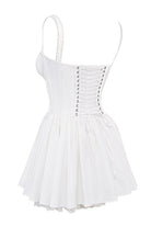 White mini dress by Lumina Vancouver with lace-trimmed bodice, featuring a fitted silhouette and delicate detailing.