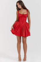 White mini dress by Lumina Vancouver with lace trim on bodice, featuring a fitted silhouette and delicate fabric details.