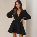 Black Lumina Wear Aria mini dress with deep V-neck, fitted silhouette, and sleeveless design, perfect for stylish occasions.