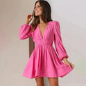 Black Aria mini dress with deep V-neck from Lumina Wear, form-fitting style perfect for stylish occasions.
