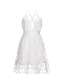 White Lumina Aria mini dress with spaghetti straps and deep V-neck, showcased on a model.