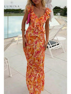 Orange Ariella Floral Ruffle Dress by Lumina Vancouver, perfect for holiday vibes, displayed on a young girl.