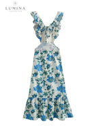 Orange Ariella floral ruffle dress by Lumina Vancouver, perfect for holiday vibes, shown on a child size 4-6 XS.
