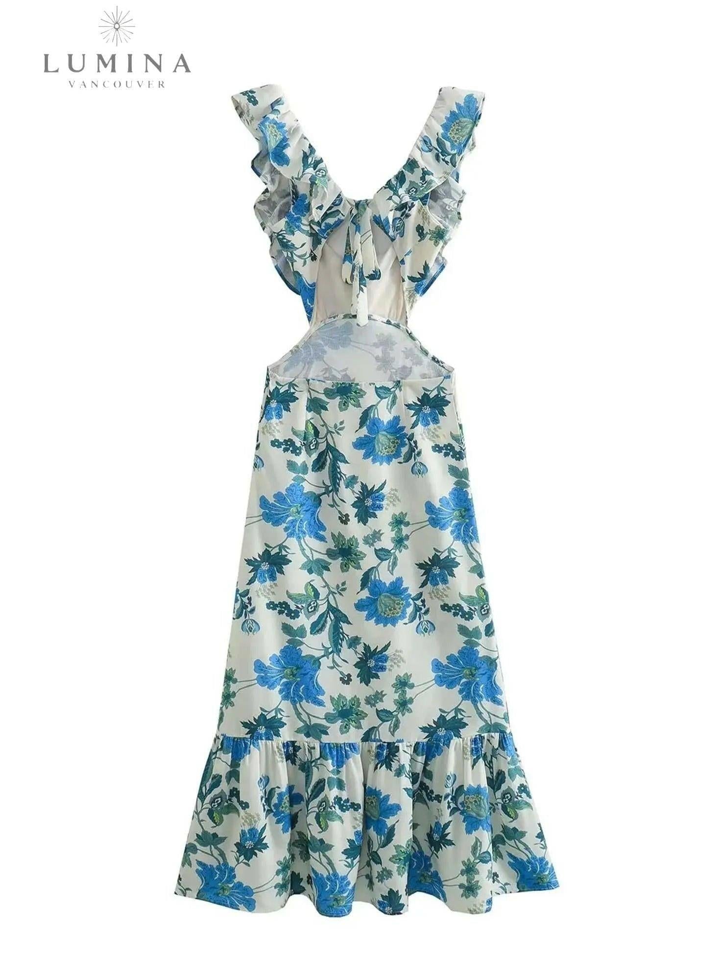 Orange Ariella floral ruffle dress by Lumina Vancouver, perfect for holiday vibes, shown on a child size 4-6 XS.