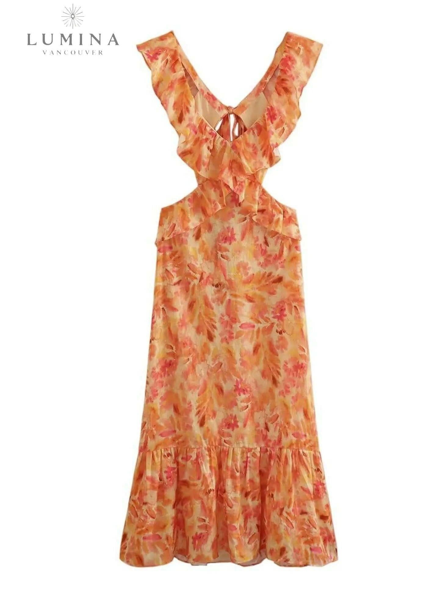 Orange Ariella floral ruffle dress by Lumina Wear for girls, featuring a playful floral pattern and ruffled details.