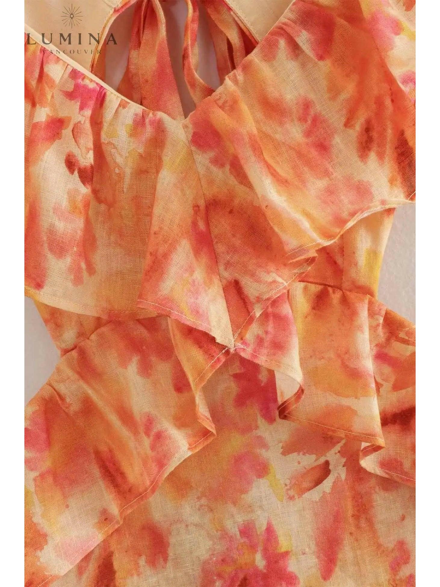 Ariella floral ruffle dress in orange for girls, perfect for holiday vibes, by Lumina Vancouver, displayed on a child.