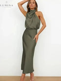 Black Ashley cocktail dress by Lumina Wear, elegant evening dress with a fitted silhouette, perfect for wedding guest attire.