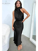 Black Ashley cocktail dress by Lumina Wear, elegant evening dress for wedding guests, shown in size S with stylish details.