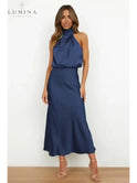 Black Ashley cocktail dress by Lumina Wear, elegant evening dress with a fitted silhouette, perfect for wedding guest attire.