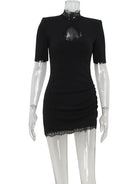 Black Nanna mini dress with bodycon fit from Lumina Vancouver, shown on a model, highlighting its sleek, form-fitting design.