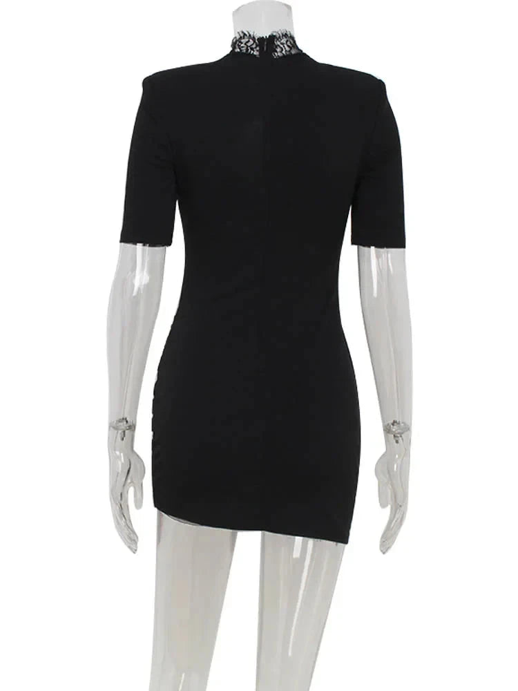 Black mini dress with bodycon fit by Lumina Vancouver, featuring a sleek, fitted silhouette perfect for stylish occasions.