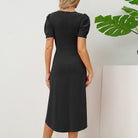 Black Ragnhild mini dress with puff sleeves by Lumina Vancouver, shown on a model with a fitted silhouette and stylish design.