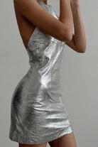 Silver halter mini dress by Lumina Vancouver featuring a fitted silhouette and stylish design, perfect for evening wear.