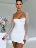 Lumina Wear Astraeon white bodycon mini dress with ruched design, fitted style, shown on a model in a close-up shot.