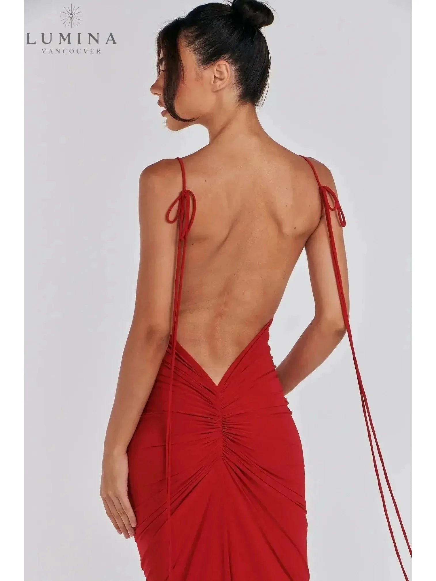 Red Astrid backless maxi dress by Lumina Vancouver, stylish wedding guest gown with elegant flowy fabric and fitted design.