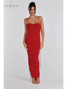 Red Astrid backless maxi dress by Lumina Vancouver, elegant wedding guest gown with flowing fabric and sleeveless design.