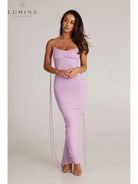 Red Astrid backless maxi dress by Lumina Vancouver, perfect for wedding guests, shown on a model with flowing fabric and elegant design.