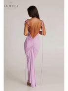Red Astrid backless maxi dress by Lumina Vancouver, elegant wedding guest gown with flowing fabric and stylish design.