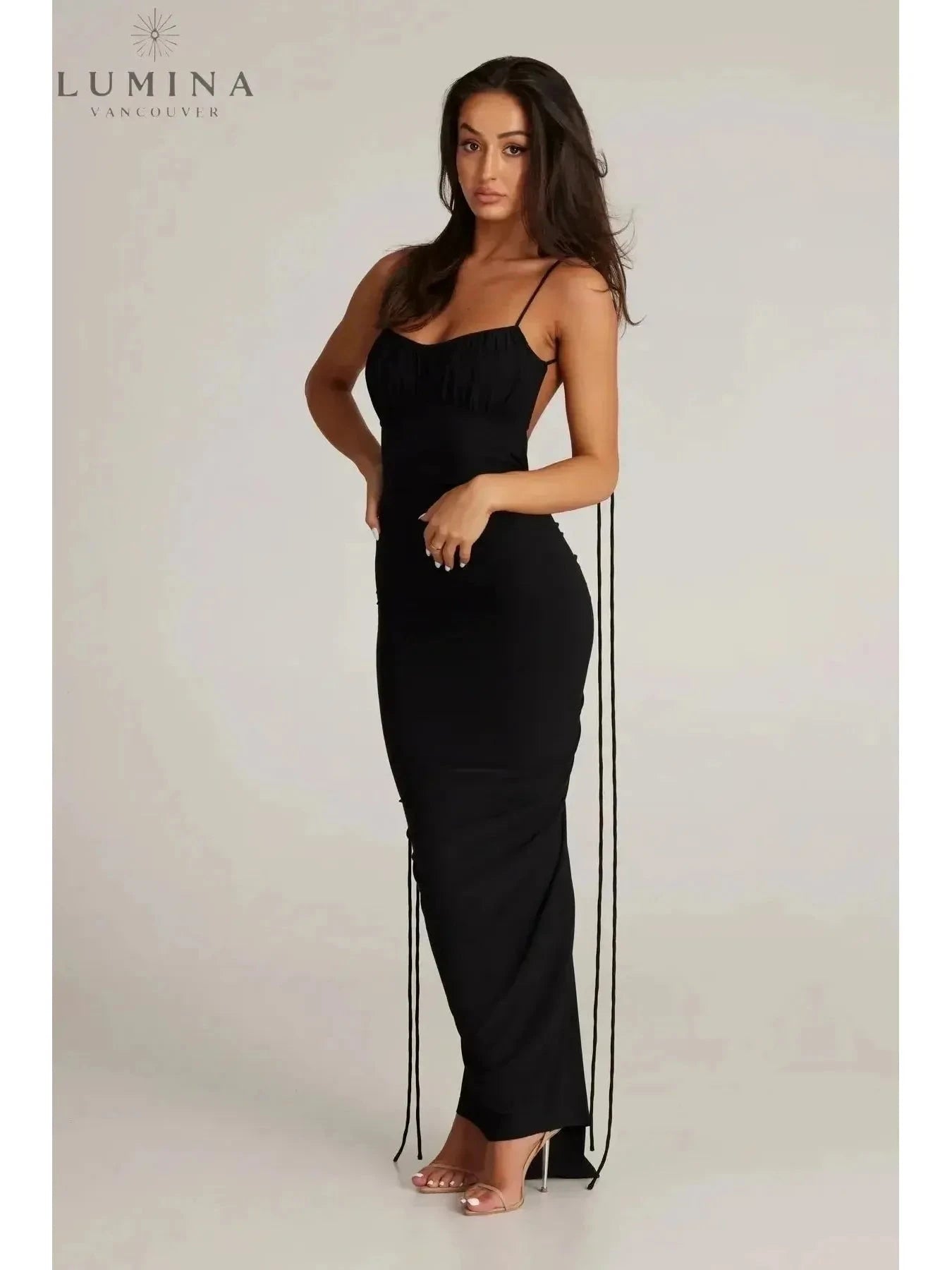 Red Astrid backless maxi dress by Lumina Wear, perfect for wedding guests, featuring a flowing silhouette and elegant design.