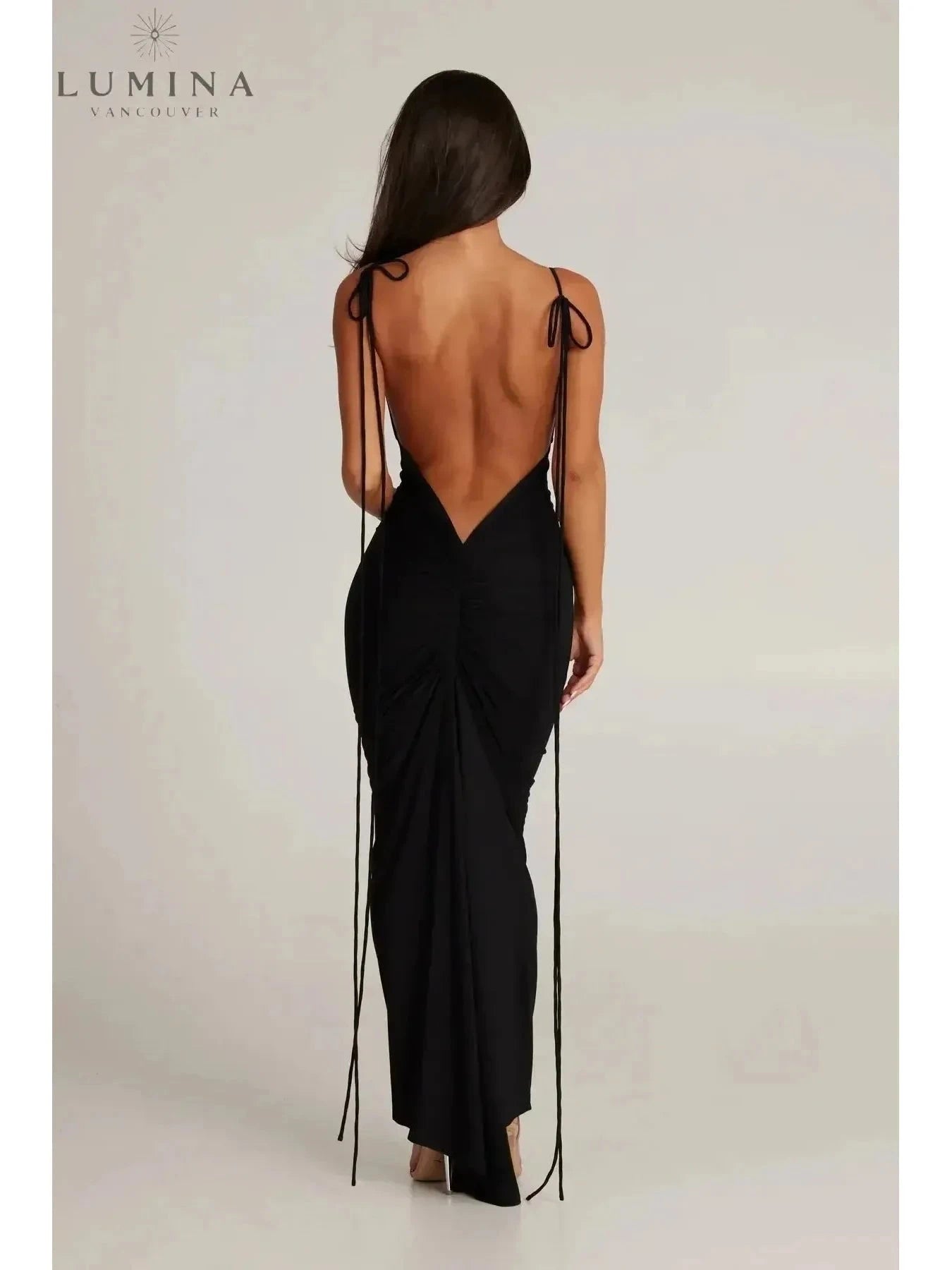 Red Astrid backless maxi dress by Lumina Vancouver, perfect for wedding guests, shown on a model with elegant styling.