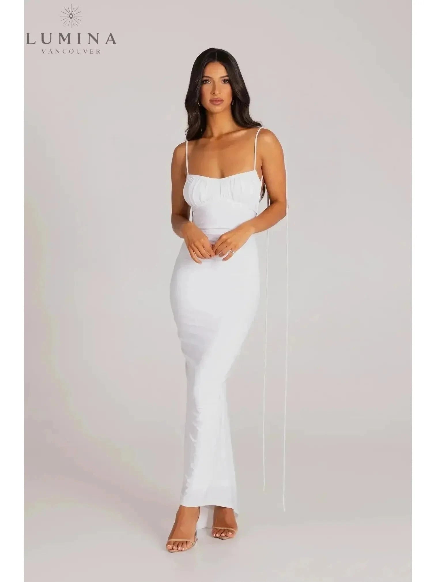 Red Astrid backless maxi dress by Lumina Wear, featuring a flowing silhouette perfect for wedding guests and elegant occasions.