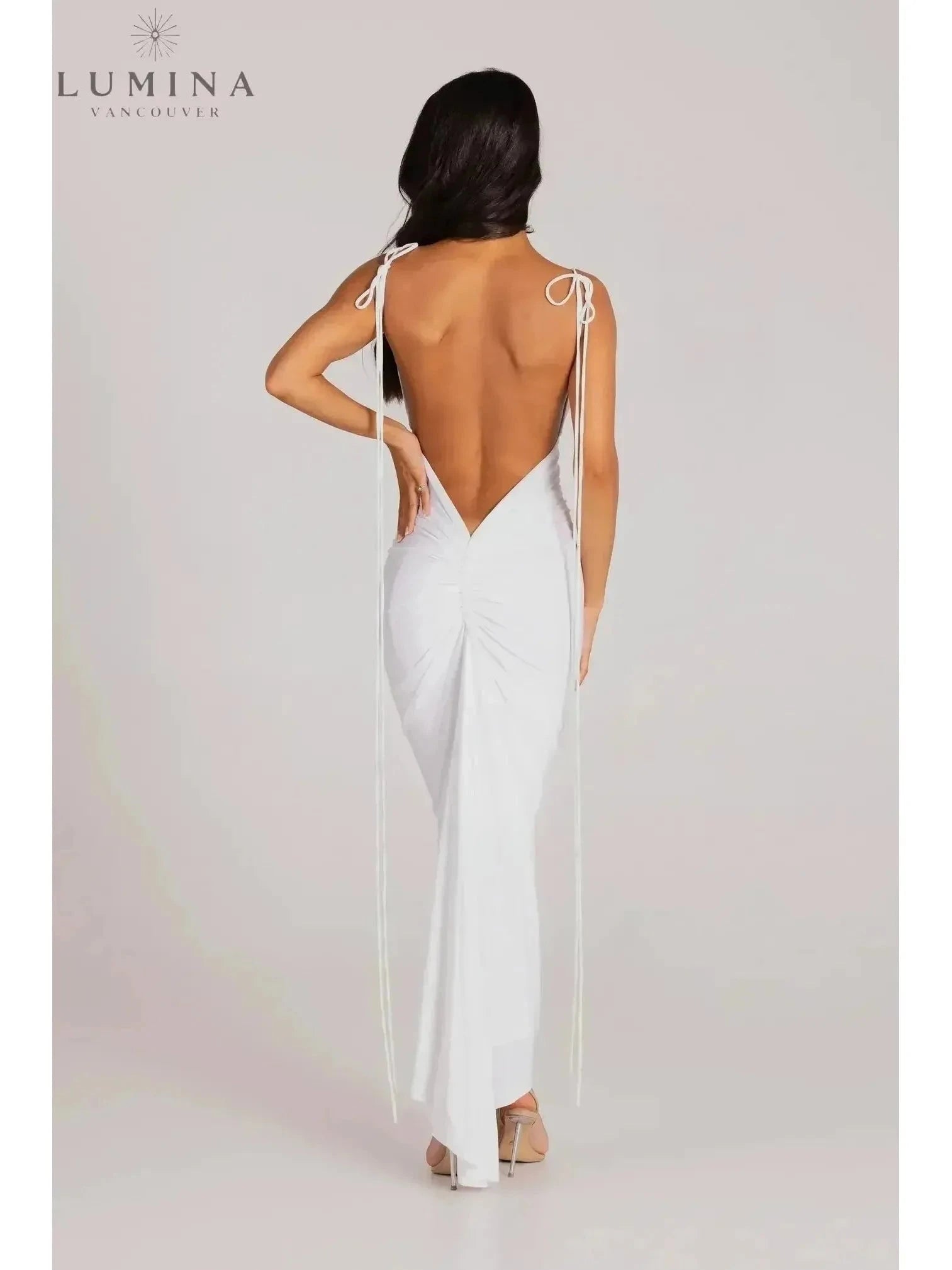Red Astrid backless maxi dress by Lumina Vancouver, elegant wedding guest gown with a flowing silhouette and stylish design.