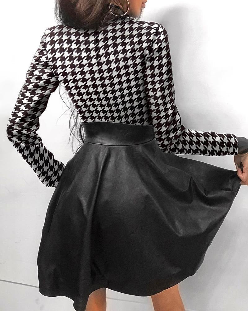 Black faux leather mini dress by Lumina Vancouver featuring a sleek, fitted silhouette and stylish design.