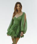 Green AureliaGrace V-Neck Wrap Mini Dress by Lumina Wear, shown on a model with a fitted waist and flowing skirt.