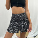 Dark pink Aurelie bohemian skirt with playful ruffles and vibrant print by Lumina Wear, perfect for casual and boho style.