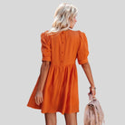 Lempi Celeste Moonshadow mini dress by Lumina Vancouver in vibrant orange with celestial moonshadow pattern, short length, XS size.
