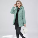 Aqua green Lumina Wear Ava quilted hooded puffer jacket with streamlined fit and quilted design, shown on a model.