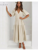 Cream Avalon dress with puff sleeves by Lumina Wear, featuring a stylish design suitable for wedding guests.