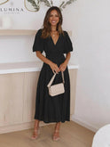 Cream Avalon dress with puff sleeves by Lumina Wear, featuring a stylish fit perfect for wedding guests.