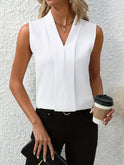 White Beatrice blouse by Lumina Wear with elegant pleated design and V-neck, perfect for stylish women's fashion.