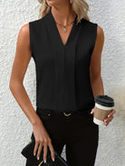 White women's blouse by Lumina Wear featuring elegant pleated design and V-neck, styled for a sophisticated look.
