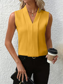 White Beatrice Lumina Wear blouse with elegant pleated design and V-neck, featuring a stylish, feminine fit for women.