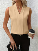 White Beatrice Lumina Wear blouse with elegant pleated design and V-neck, perfect for stylish women’s fashion.