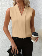 White women's blouse with elegant pleated design and V-neck by Lumina Wear, styled with long sleeves and a relaxed fit.