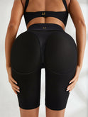 Black Lumina Wear Beauty Back quick-drying yoga bra with matching bicycle shorts, designed for comfortable activewear.